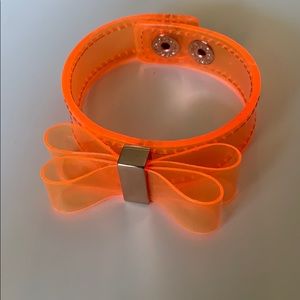 BCBG holographic orange bow bracelet